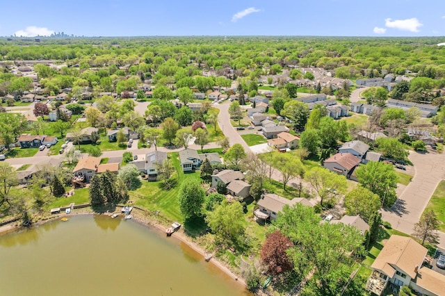 aerial perspective of suburban area with a large body of water