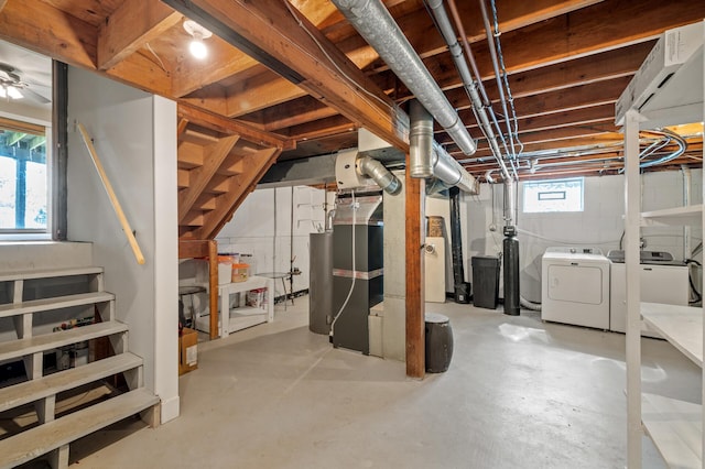 basement featuring separate washer and dryer and stairs