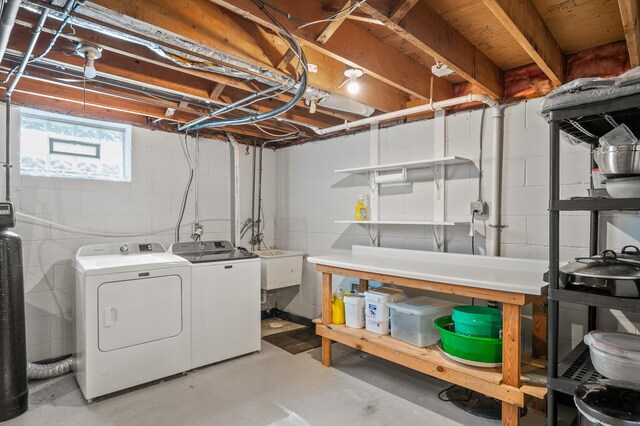 below grade area featuring washing machine and dryer
