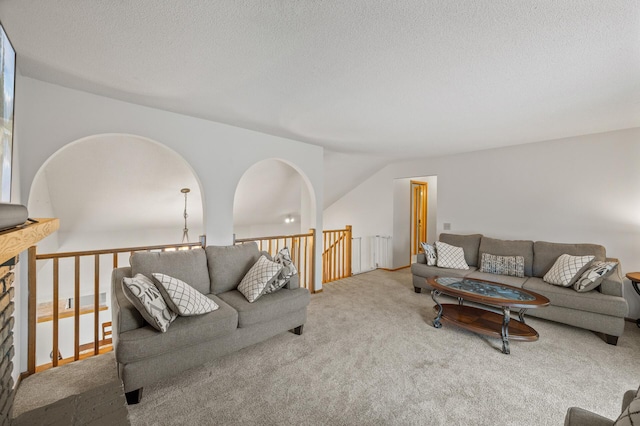 carpeted living room with a textured ceiling