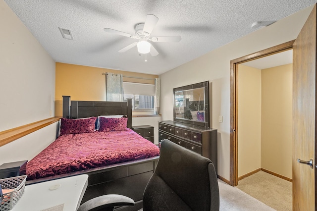 bedroom with carpet floors, ceiling fan, a textured ceiling, and baseboards
