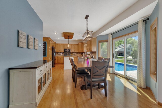 1502 9th St N, Sartell, MN 56377 - dining space with light wood finished floors and recessed lighting