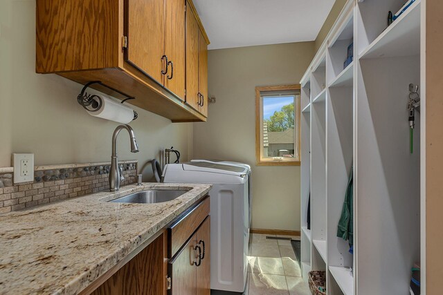 1502 9th St N, Sartell, MN 56377 - laundry area featuring cabinet space, light tile patterned floors, and separate washer and dryer