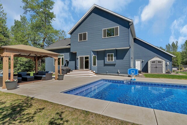 1502 9th St N, Sartell, MN 56377 - back of property with an outdoor living space, a gazebo, a patio area, and an outdoor pool
