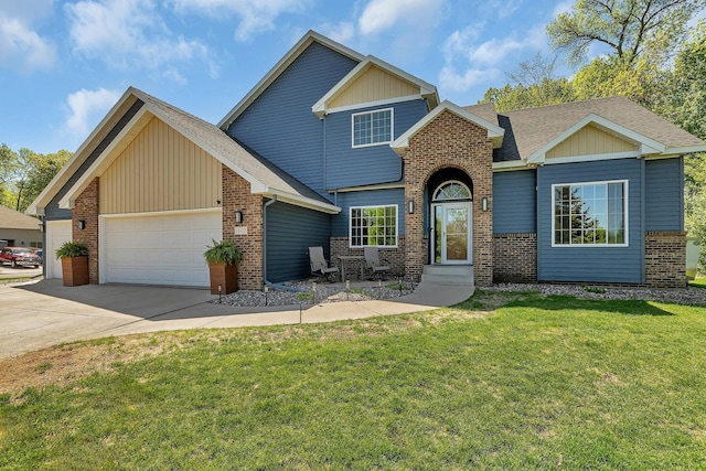 1502 9th St N, Sartell, MN 56377 - view of front of home featuring brick siding, a garage, and driveway