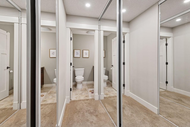 215 Barry Ave S Unit 306, Wayzata, MN 55391 - bathroom with toilet, recessed lighting, and baseboards