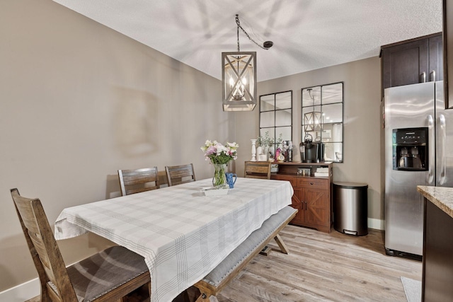 215 Barry Ave S Unit 306, Wayzata, MN 55391 - dining space featuring light wood-style floors and baseboards