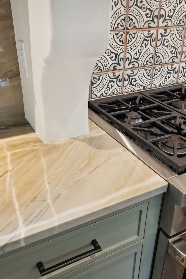 kitchen view of light countertops and range
