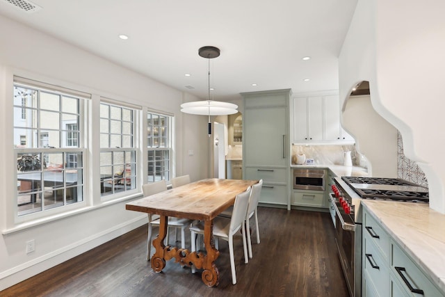 dining area featuring dark wood-style flooring, recessed lighting, and baseboards