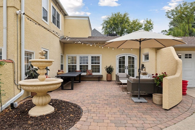 view of patio with french doors and an outdoor living space