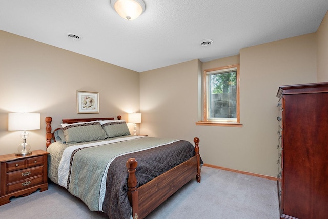 bedroom featuring light carpet and baseboards