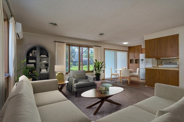 529 Spring St Unit 4, Kenyon, MN 55946 - living area with an AC wall unit, carpet floors, a textured ceiling, and recessed lighting