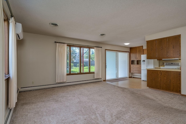 529 Spring St Unit 4, Kenyon, MN 55946 - unfurnished living room with a baseboard radiator, a wall unit AC, light carpet, a textured ceiling, and baseboard heating