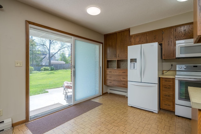529 Spring St Unit 4, Kenyon, MN 55946 - kitchen featuring white appliances, a baseboard radiator, brown cabinets, and a textured ceiling