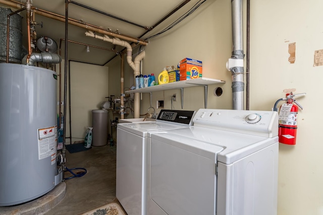 529 Spring St Unit 4, Kenyon, MN 55946 - clothes washing area with gas water heater and washer and dryer