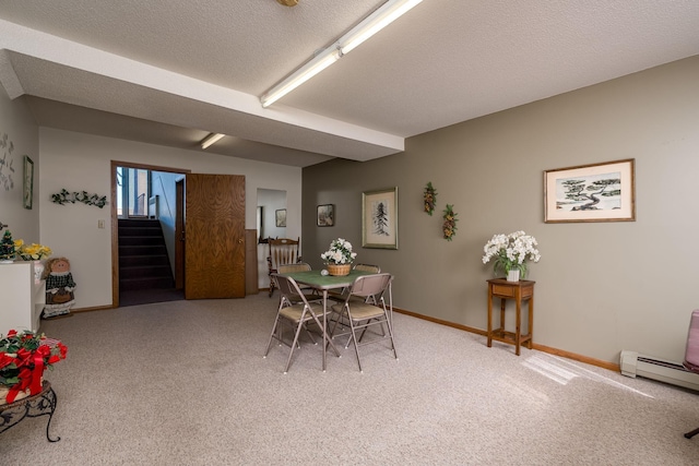 529 Spring St Unit 4, Kenyon, MN 55946 - dining space with light carpet, stairs, baseboard heating, baseboards, and a textured ceiling