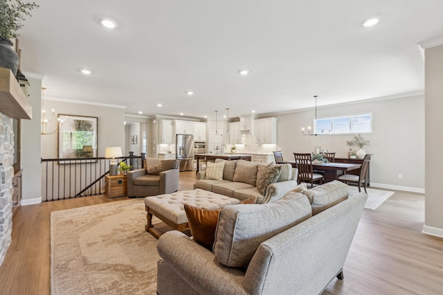 8014 Walnut Ln, Corcoran, MN 55340 - living area featuring crown molding, healthy amount of natural light, recessed lighting, light wood-style floors, and a chandelier