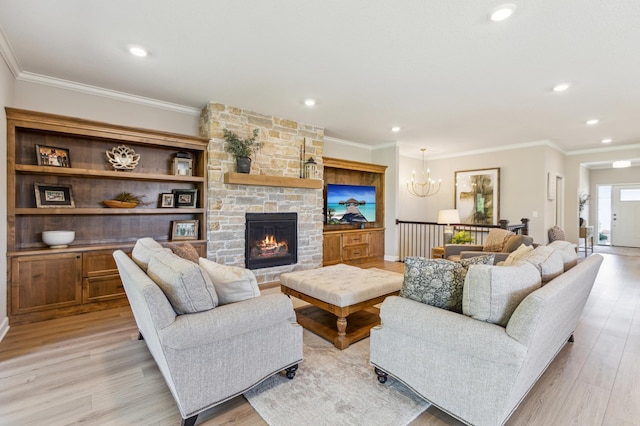 8014 Walnut Ln, Corcoran, MN 55340 - living room with light wood-style flooring, a chandelier, crown molding, recessed lighting, and a fireplace