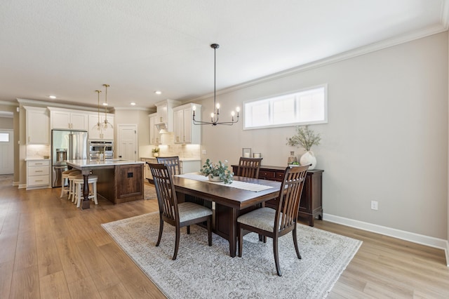 8014 Walnut Ln, Corcoran, MN 55340 - dining space with a chandelier, ornamental molding, light wood finished floors, and recessed lighting