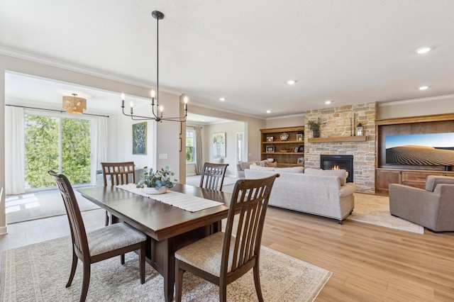 8014 Walnut Ln, Corcoran, MN 55340 - dining area with ornamental molding, healthy amount of natural light, light wood-style floors, recessed lighting, and a chandelier