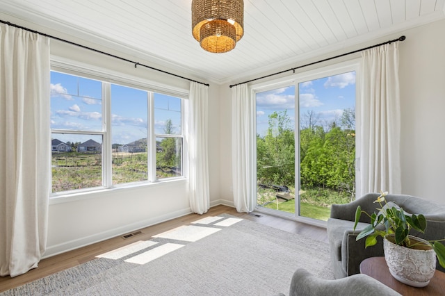 8014 Walnut Ln, Corcoran, MN 55340 - sunroom featuring a chandelier