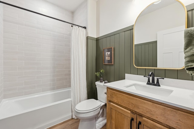 8014 Walnut Ln, Corcoran, MN 55340 - bathroom featuring wood finished floors, vanity, shower / bath combo with shower curtain, and a wainscoted wall