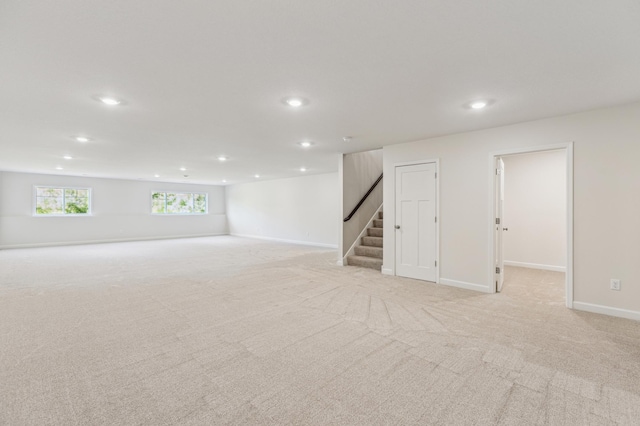 8014 Walnut Ln, Corcoran, MN 55340 - below grade area with recessed lighting, stairway, and light carpet