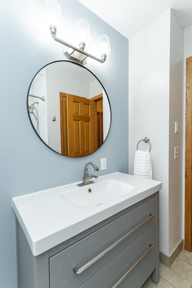 bathroom with vanity and baseboards