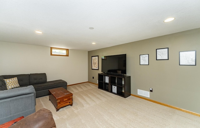living area with light carpet, recessed lighting, and baseboards