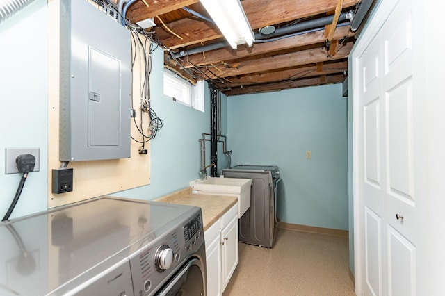 laundry area with washer and clothes dryer, cabinet space, and electric panel