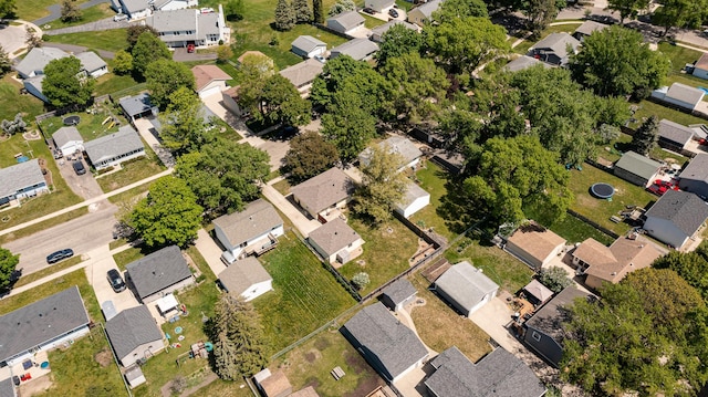 aerial view of property and surrounding area featuring nearby suburban area