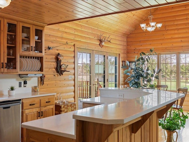 kitchen with rustic walls, wood ceiling, dishwasher, light countertops, and a kitchen island