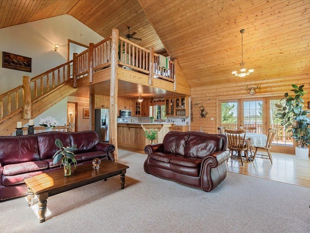 living room featuring high vaulted ceiling, stairway, light carpet, a ceiling fan, and wooden ceiling
