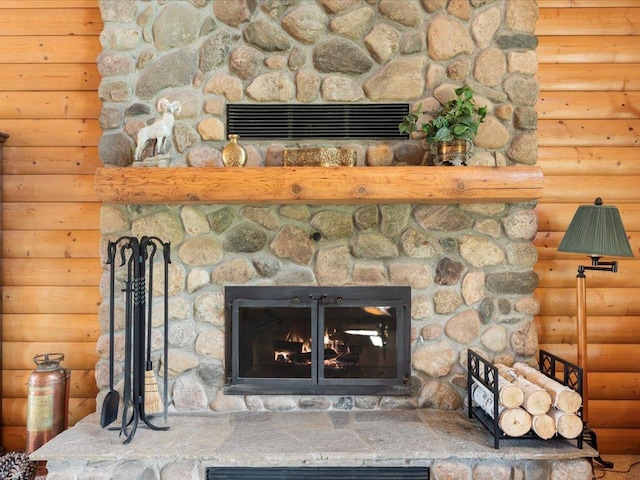 detailed view of a stone fireplace and rustic walls