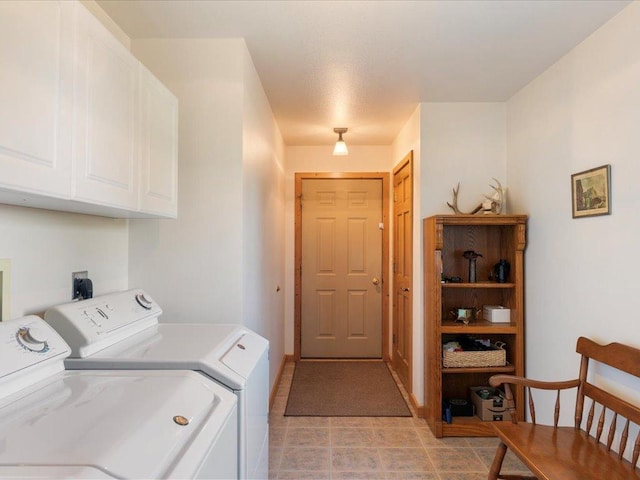 laundry room featuring cabinet space, washing machine and clothes dryer, and baseboards
