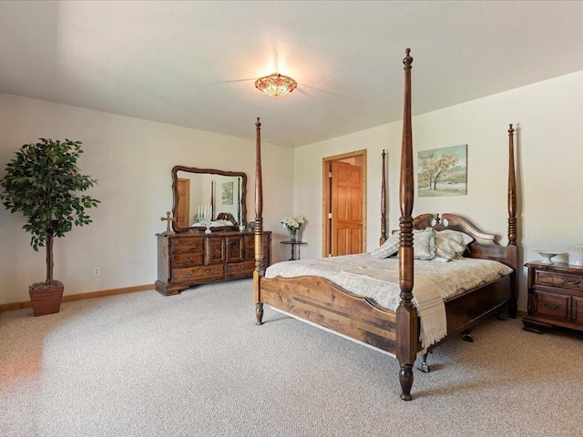 carpeted bedroom with baseboards