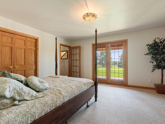 bedroom featuring light colored carpet, access to outside, baseboards, and a closet
