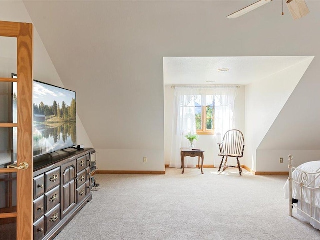 carpeted bedroom with baseboards and vaulted ceiling