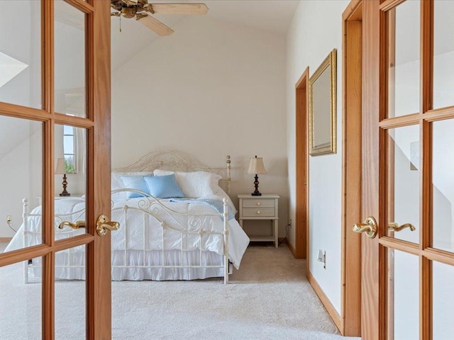 bedroom with carpet, lofted ceiling, and french doors