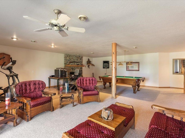 living room featuring carpet flooring, billiards, a textured ceiling, and baseboards