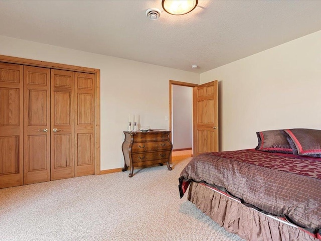 bedroom featuring light carpet and baseboards