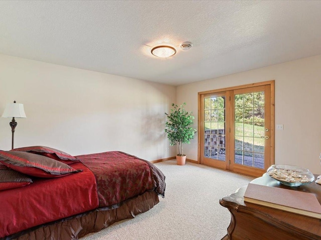 carpeted bedroom featuring access to exterior and baseboards