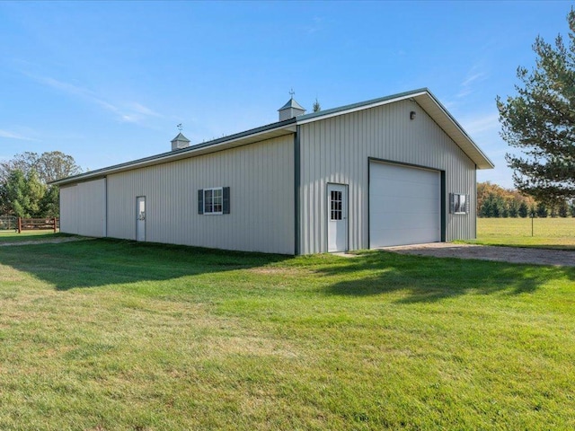detached garage with gravel driveway