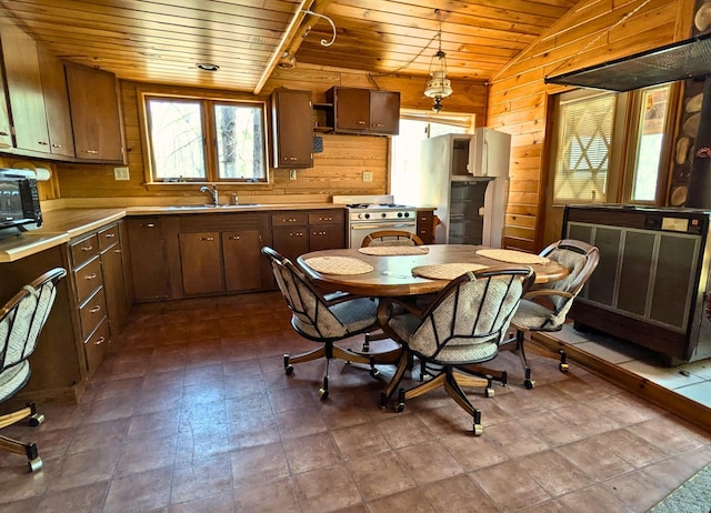 3333 Randa Rd, Orr, MN 55771 - kitchen featuring wood ceiling, a sink, vaulted ceiling, stainless steel range with gas stovetop, and light countertops