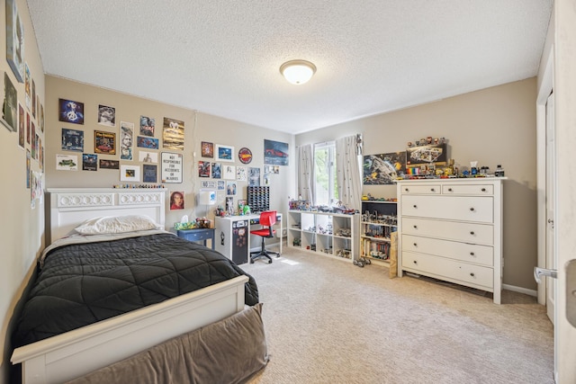 bedroom with carpet and a textured ceiling