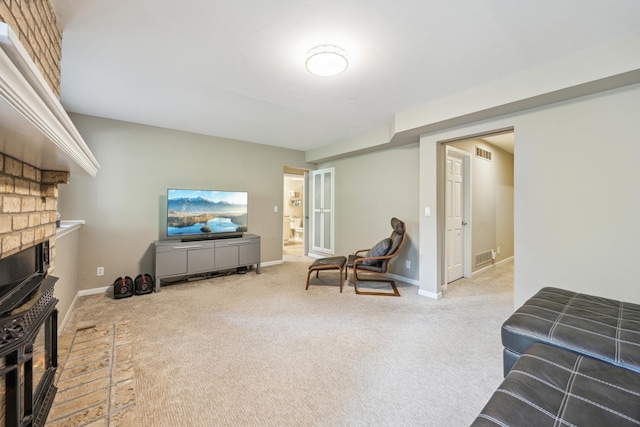 living room featuring carpet floors, a wood stove, and baseboards