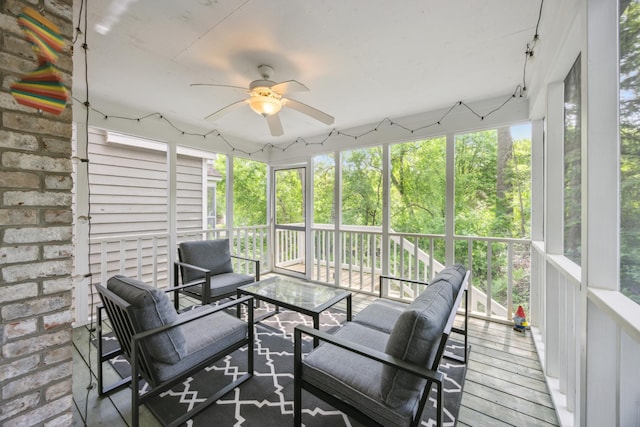 sunroom with ceiling fan and an outdoor hangout area