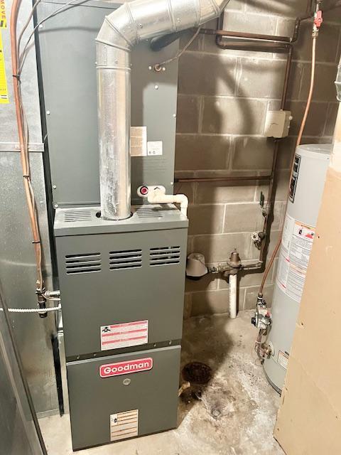 utility room with gas water heater and heating unit