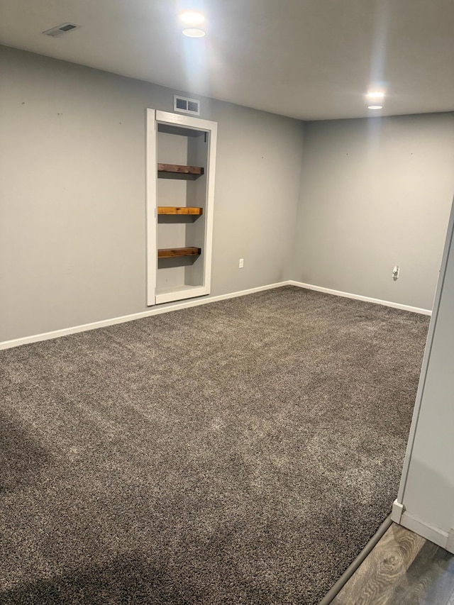 7000 164th Ave NW, Ramsey, MN 55303 - spare room with baseboards and dark carpet