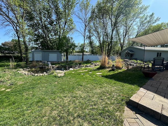 4220 23rd St NW, Willmar, MN 56201 - view of grassy yard with a patio